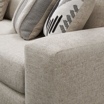 neutral  pc sectional with left facing sofa and ottoman   