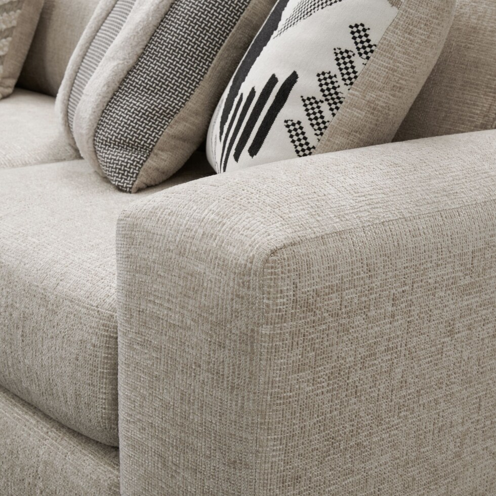 neutral  pc sectional with left facing sofa and ottoman   