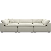 plush white  pc sectional and ottoman   